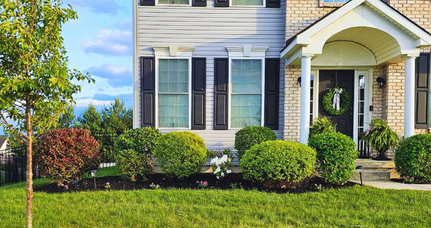 Shrub trimming service in Nazareth PA with neatly shaped bushes and clean mulch beds.”